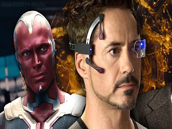 Imagem de Tony Stark usando um dispositivo tecnológico futurista, com Visão ao fundo. Ambos representam a inteligência artificial avançada no Universo Marvel.